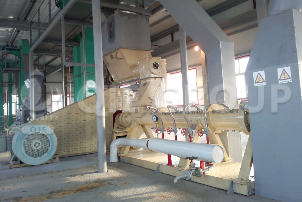 Automated soybean puffing production line with extruder, conveyor, and control panel