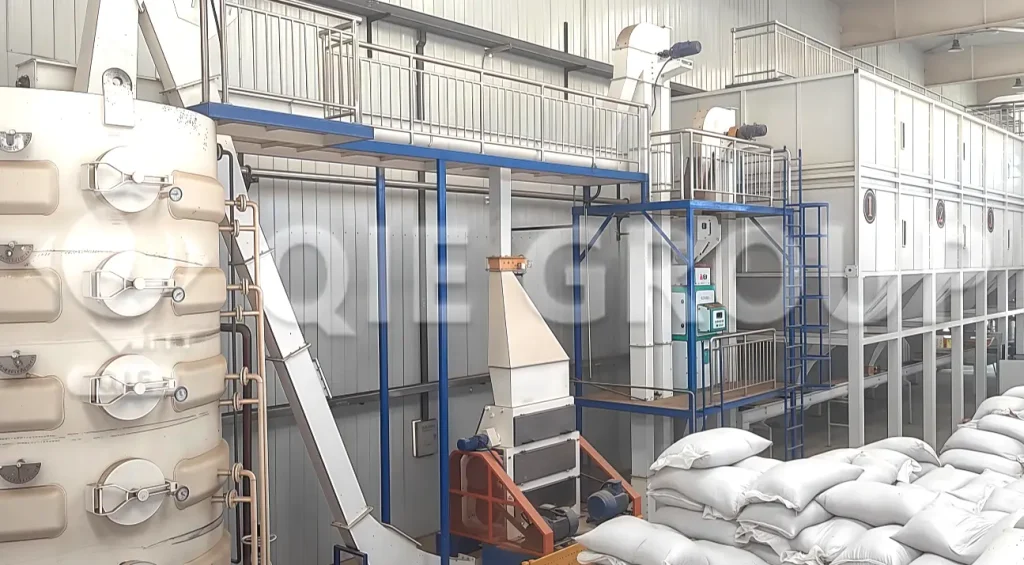 flaxseed preprocessing equipment in modern oil processing workshop, including cleaning, dehulling, and flaking machines