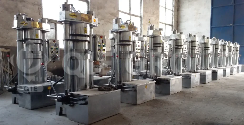 High-pressure sesame hydraulic oil press used for cold pressing sesame seeds to produce premium quality sesame oil.