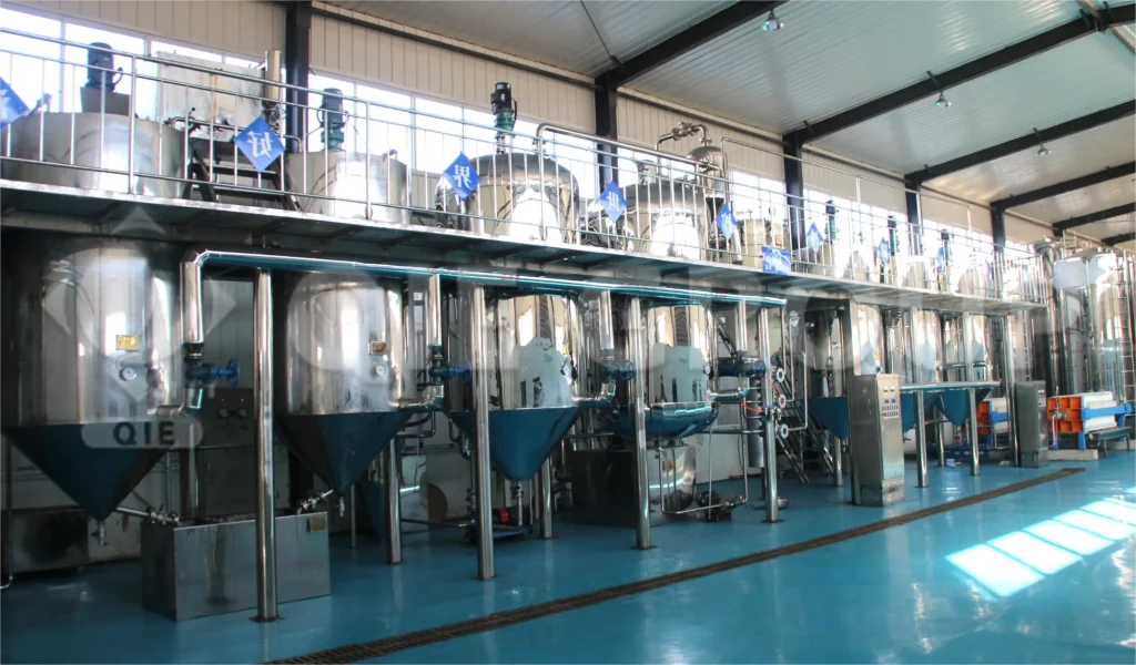 QIE Group vegetable oil refining machine with full degumming, deacidification, bleaching, and deodorization equipment on site