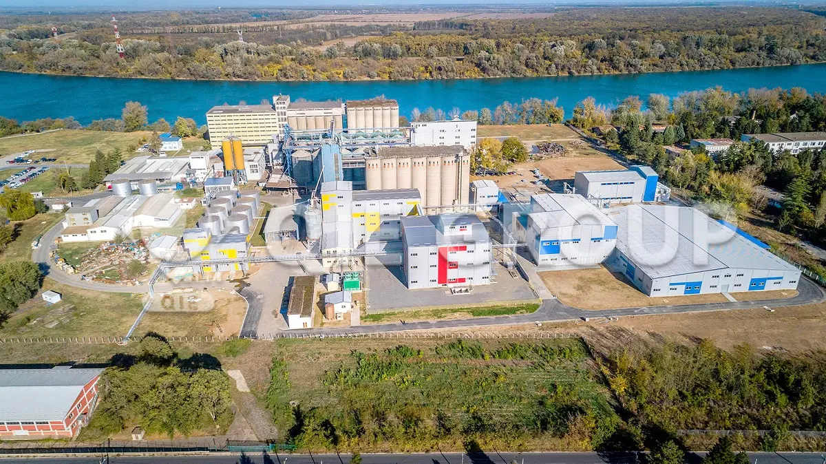 Exterior view of the QIE Group industrial park and main factory building.