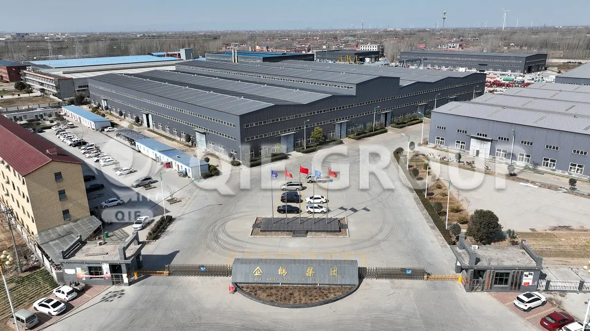 Exterior view of the QIE Group industrial park and main factory building.