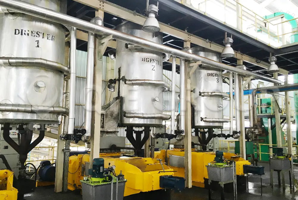 Operators managing palm fruit oil pressing operation in plant